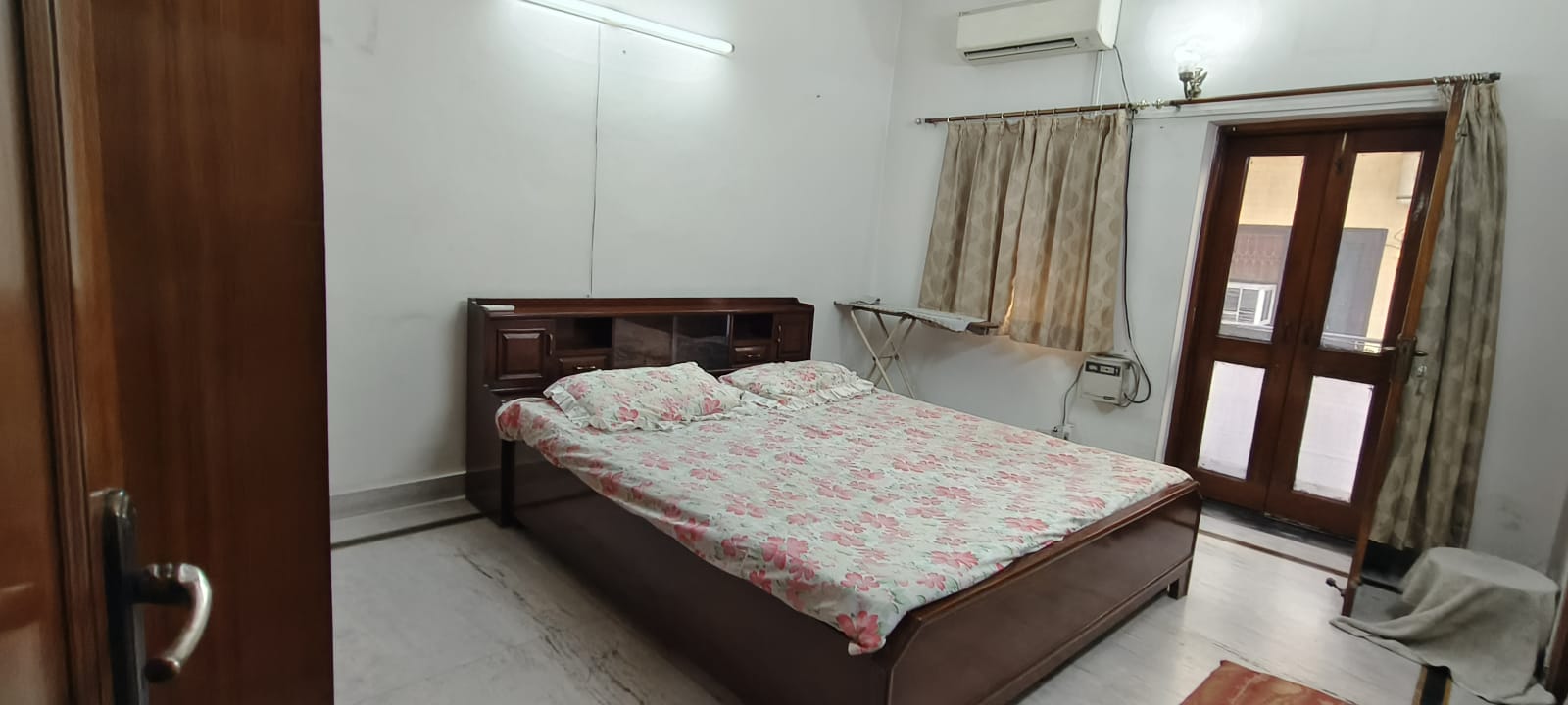 An air-conditioned room at Sanskriti Homes, Noida, made up for a resident